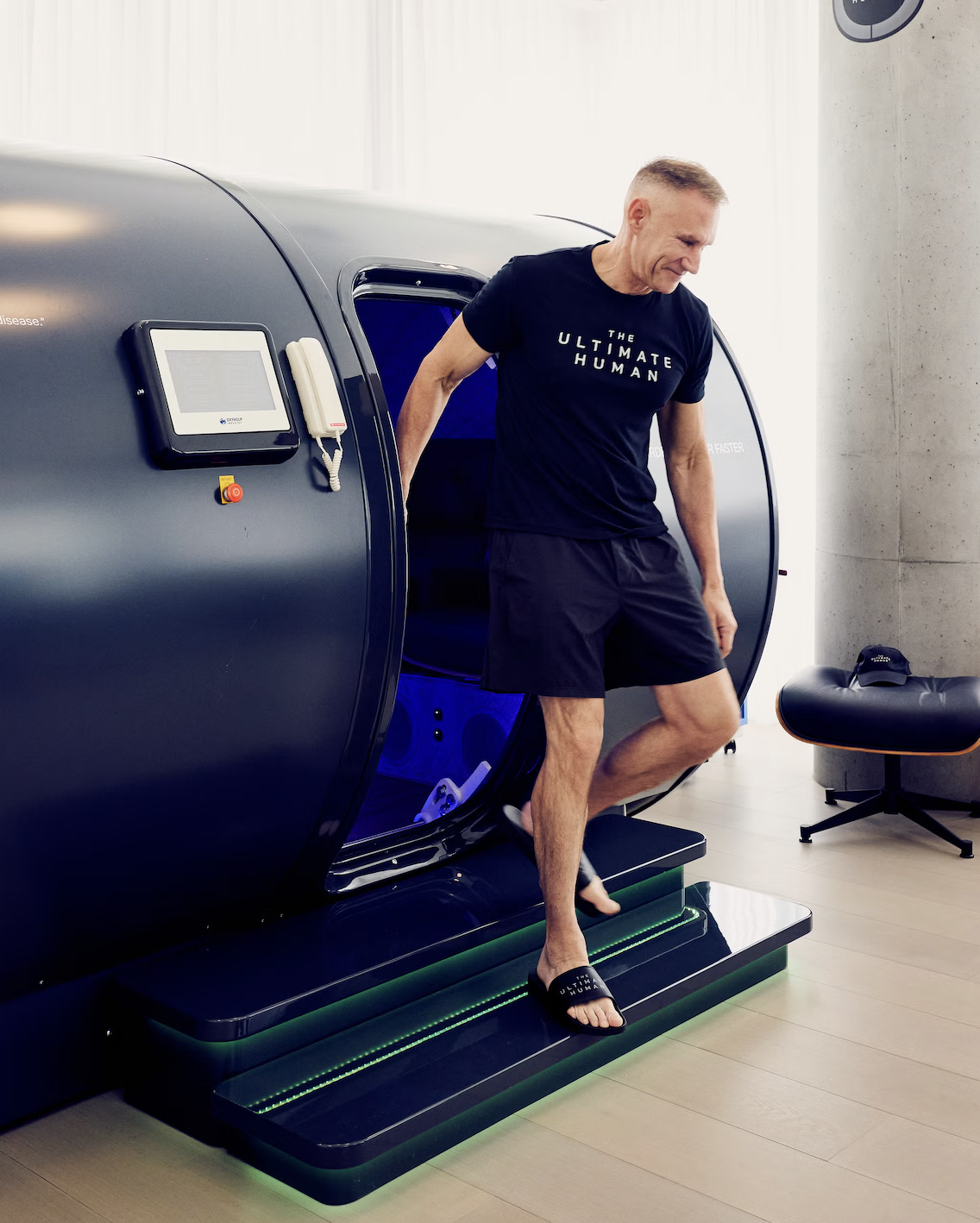Man stepping out of a premium Oxyhelp hyperbaric chamber